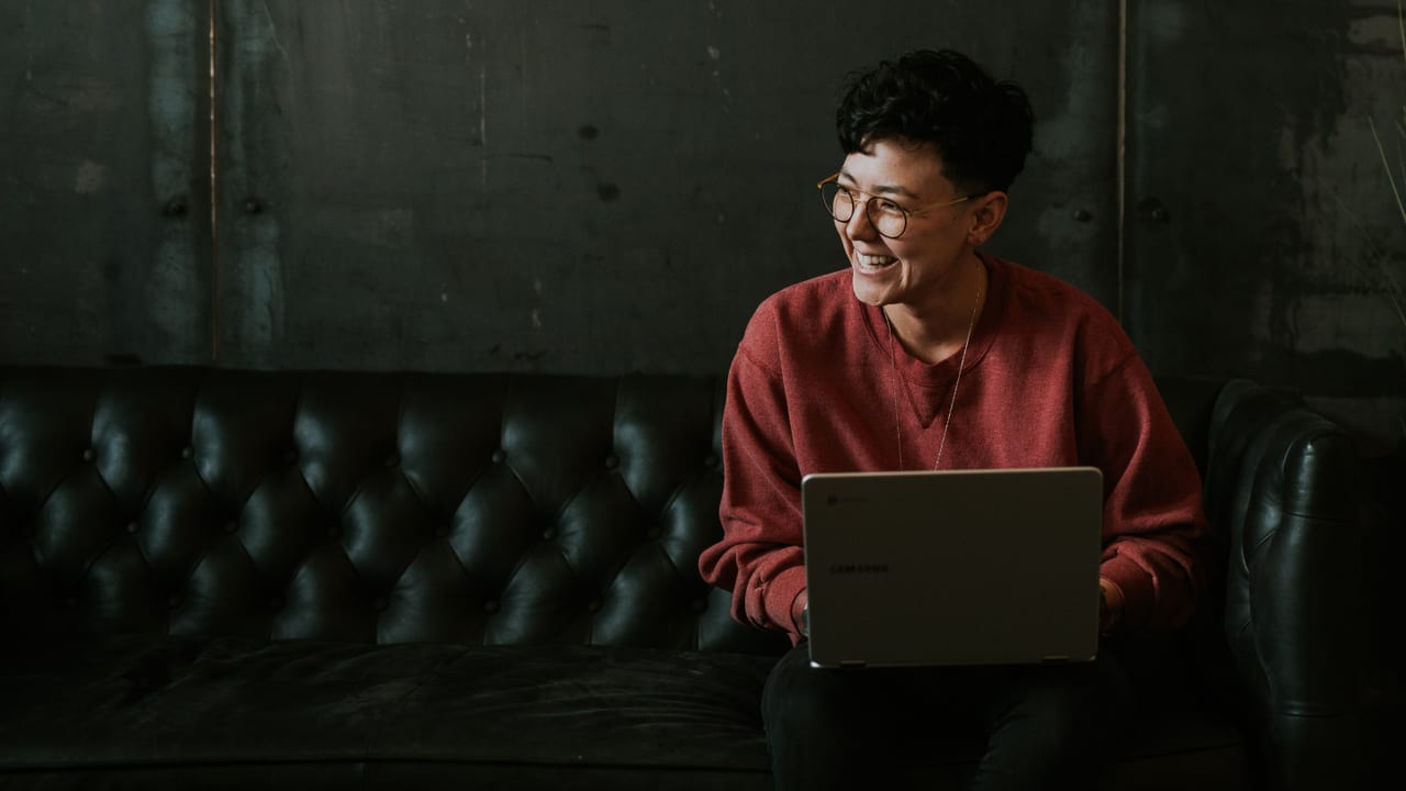 A person reading clinical research updates on a laptop
